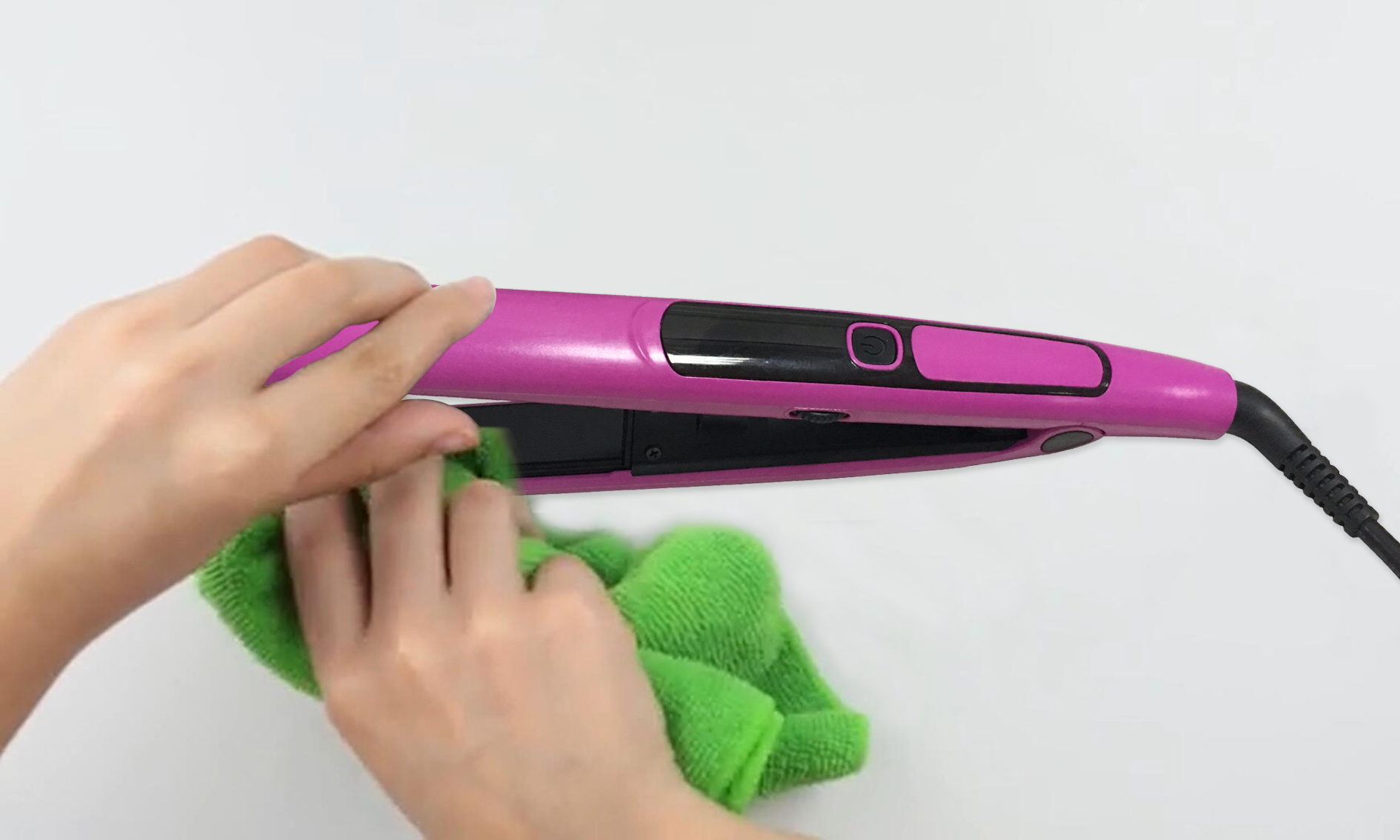 3 Wipe the flat iron down with a damp cloth or paper towel.jpg